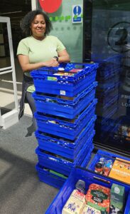 volunteer with crates